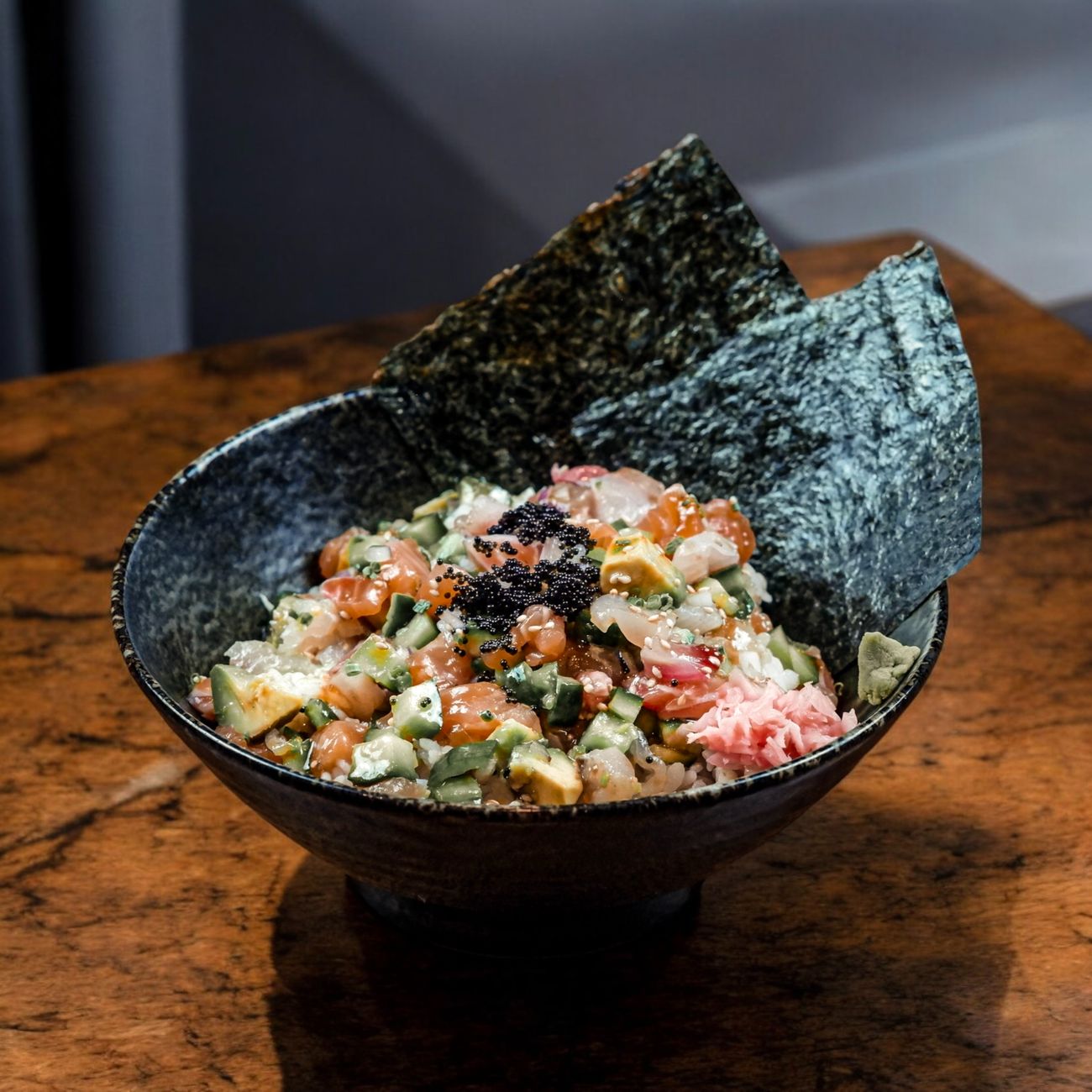 Ancient Japanese lacquerware bowl with gold maki-e decoration showing autumn maple leaves on glossy black urushi surface from Edo period.