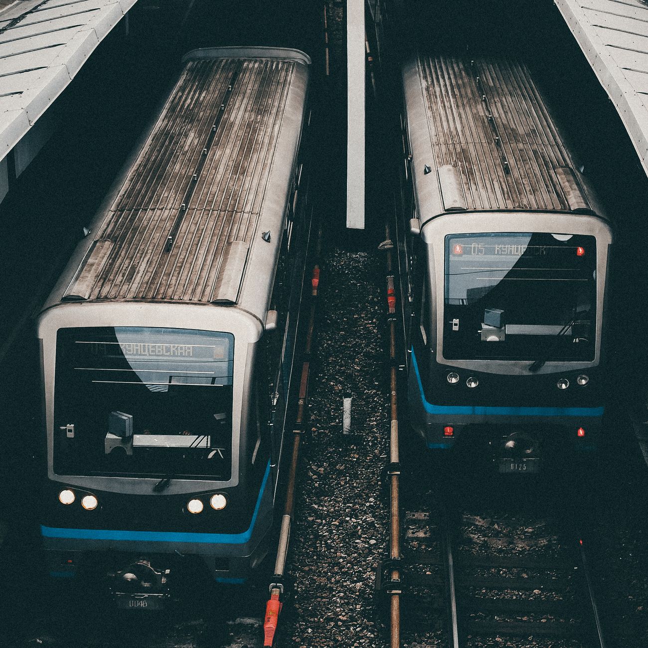 Sleek white Shinkansen bullet train waiting at a spotless platform under a modern station canopy in Japan.