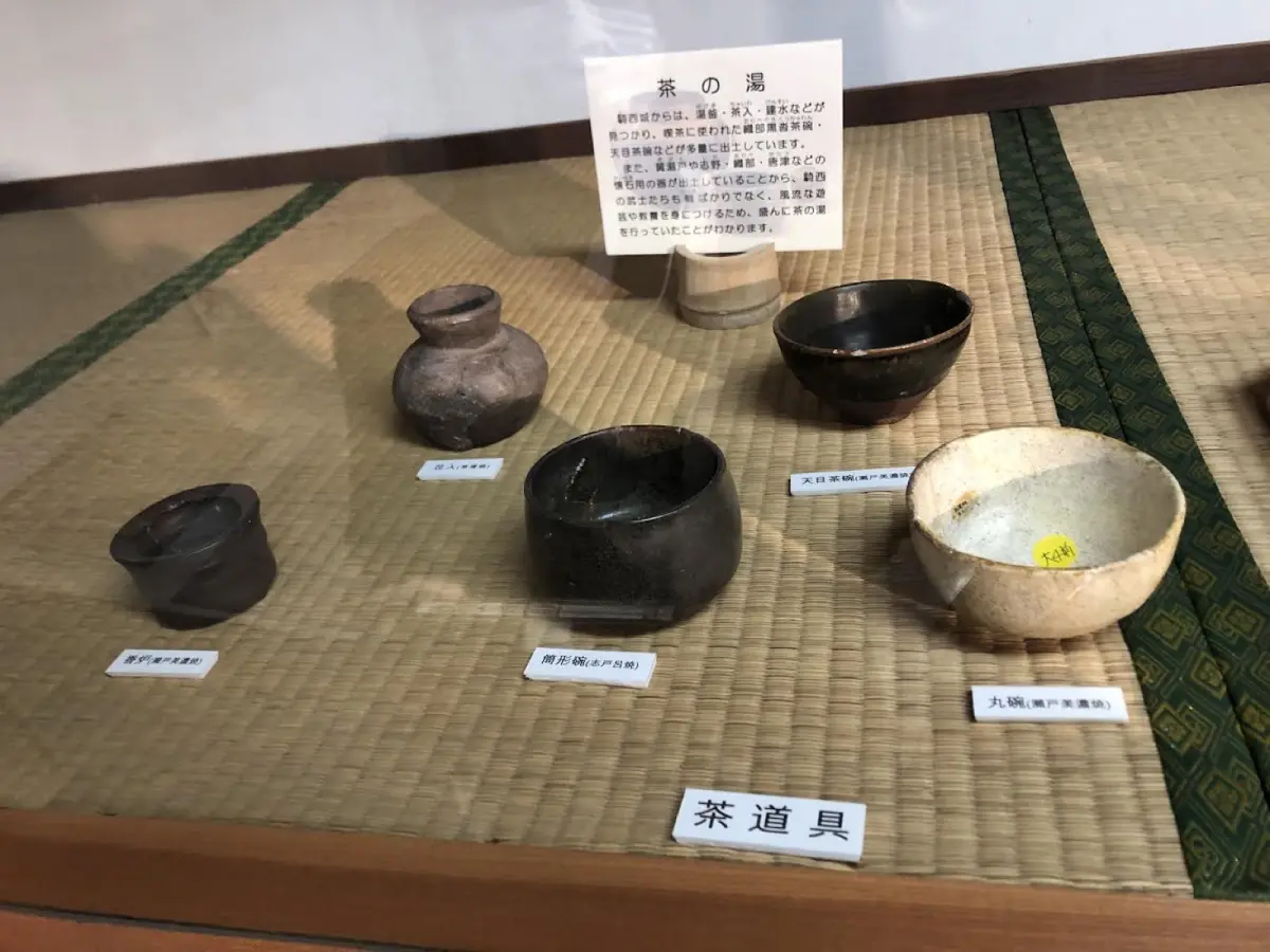 Close-up of a rustic Karatsu tea bowl with natural ash glaze and earthy texture used in traditional Japanese tea ceremony.