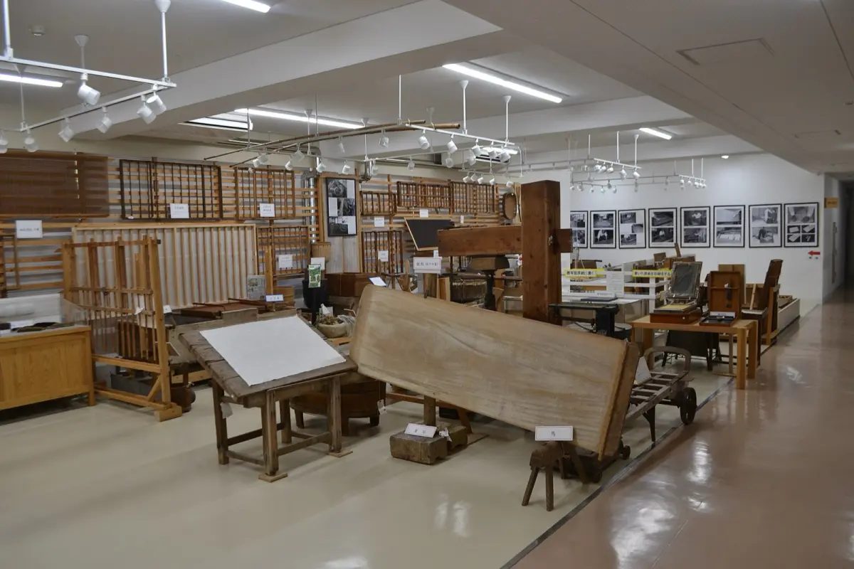 Traditional Mino washi paper stretched across a wooden shoji screen frame, showing its translucent texture and natural fibers.