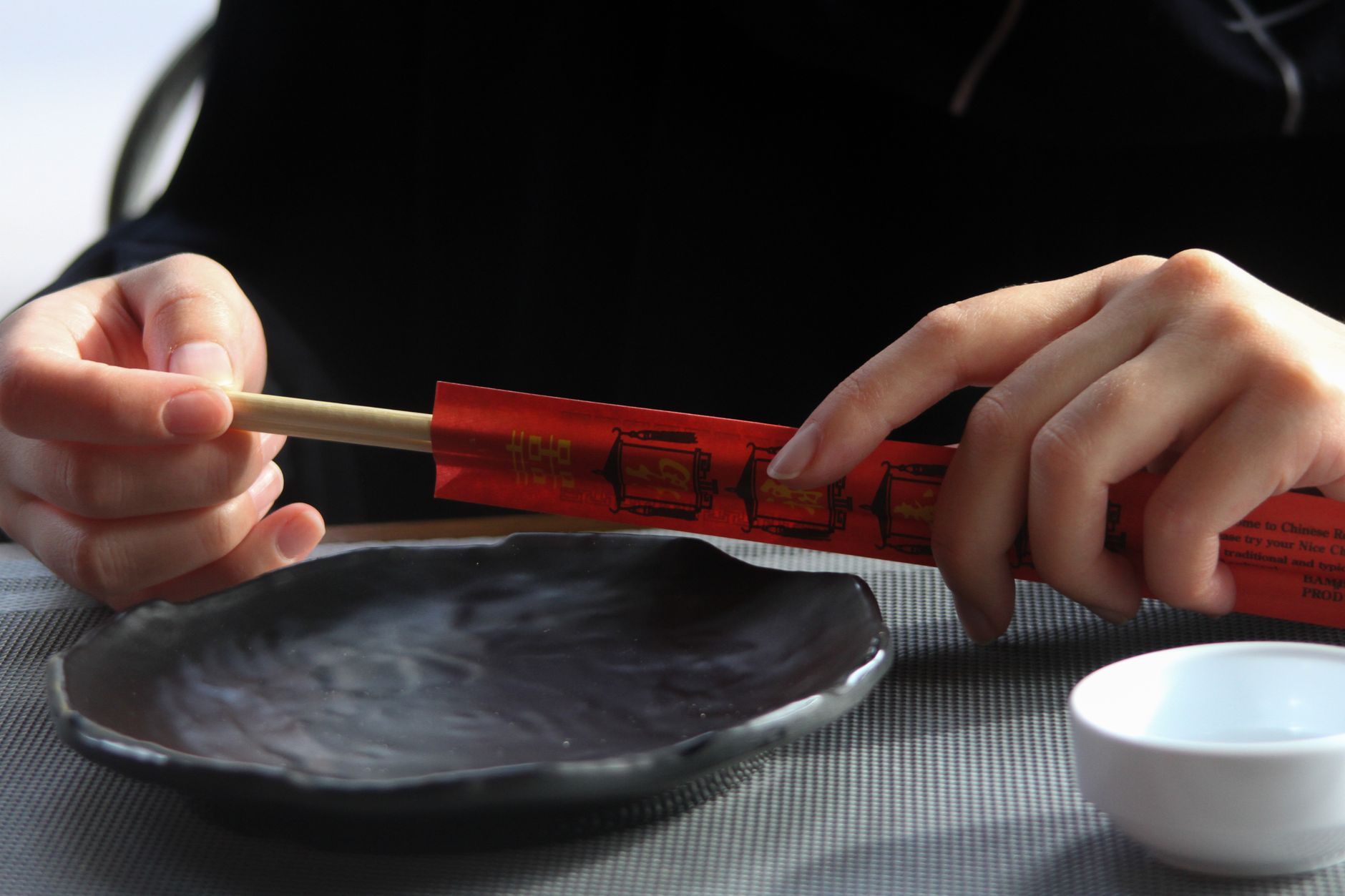 Close-up of Tsugaru nuri lacquerware showing distinctive speckled multicolored surface pattern created through traditional Aomori polishing techniques.